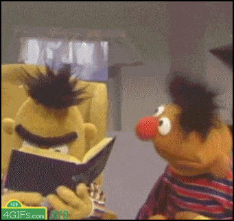 Bert is angry at Ernie for disrupting his reading; Ernie may be reading up on study tips for AP tests.