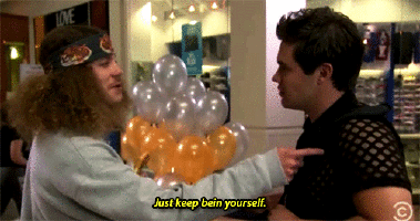 One man taps another and says "Just keep being yourself."