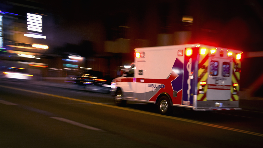 An ambulance rushing down the street