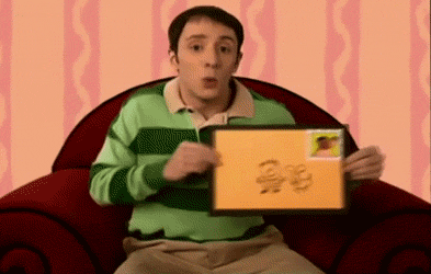 Steve dances with a large envelope