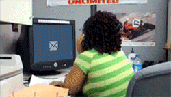 A girl gets so excited she falls out of her chair when she gets a new email.