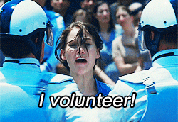 Katniss says "I volunteer!"