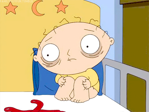 Stewie looks exhausted and rocks back in forth in a corner of his bed.