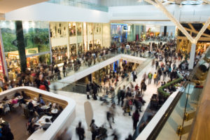 A crowded shopping mall on Black Friday; working retail during the holidays can be crazy.
