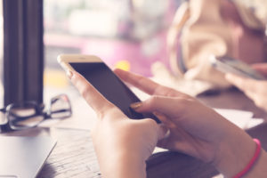 A students downloads study apps to her phone so she can study on the go.