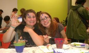 Alli and a friend paint flowerpots during "Smith To-Do" an anti-drinking event.