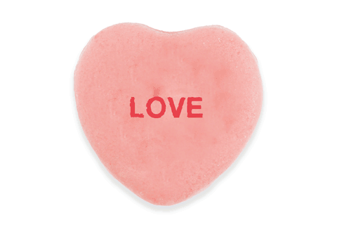 Candy hearts that say "Love is 4 chumps."