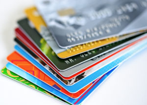 A pile of credit cards; having more than one credit card can make building credit in college difficult.