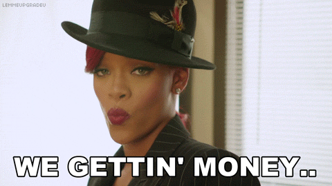 Rihanna dances and sings "We gettin' money."