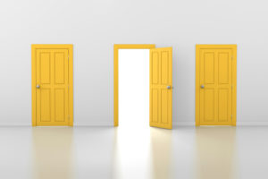 An open door in between two closed doors symbolizing choosing a college.