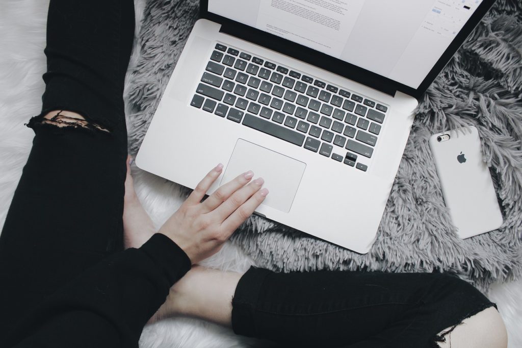 A girl works on her college application after learning what not to do on college applications.